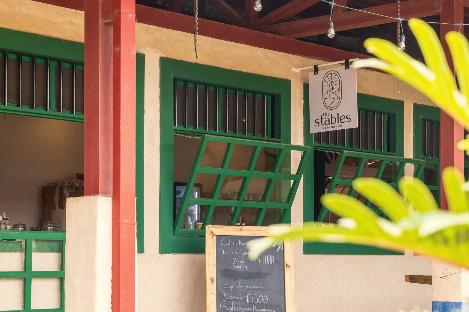 The Stables Café & Market storefront with chalkboard menu and green stable doors